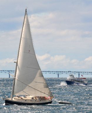 Sailboat, ferry and bridge