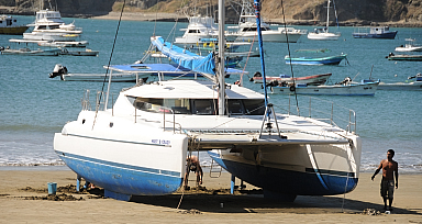 Working on the hull at low tide