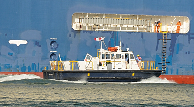 Crew transferring to underway freighter